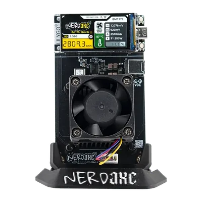 NerdAxe Gaia on its stand, seen at an angle from the front right: 40 mm fan, black heatsink and colour display